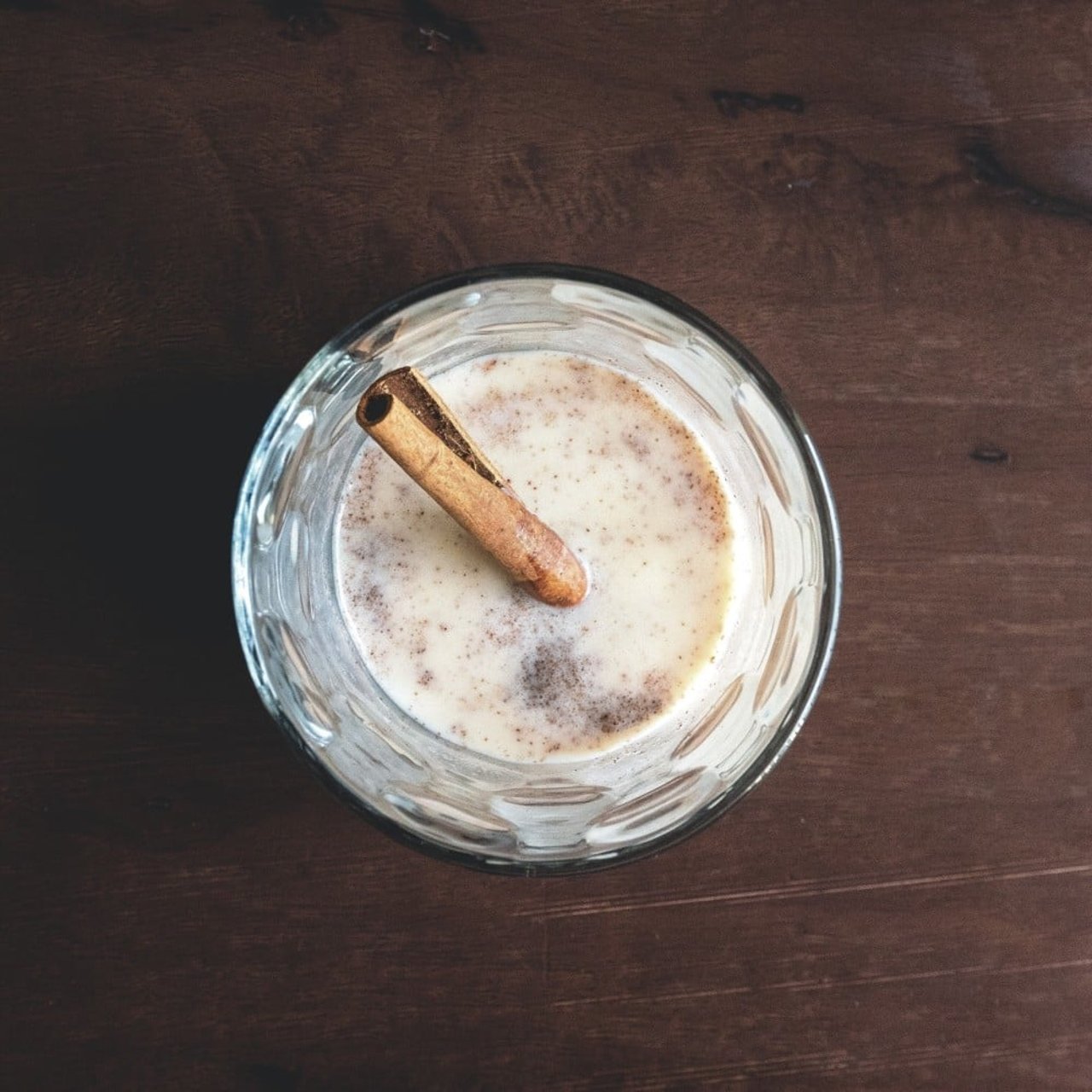 a glass of coquito