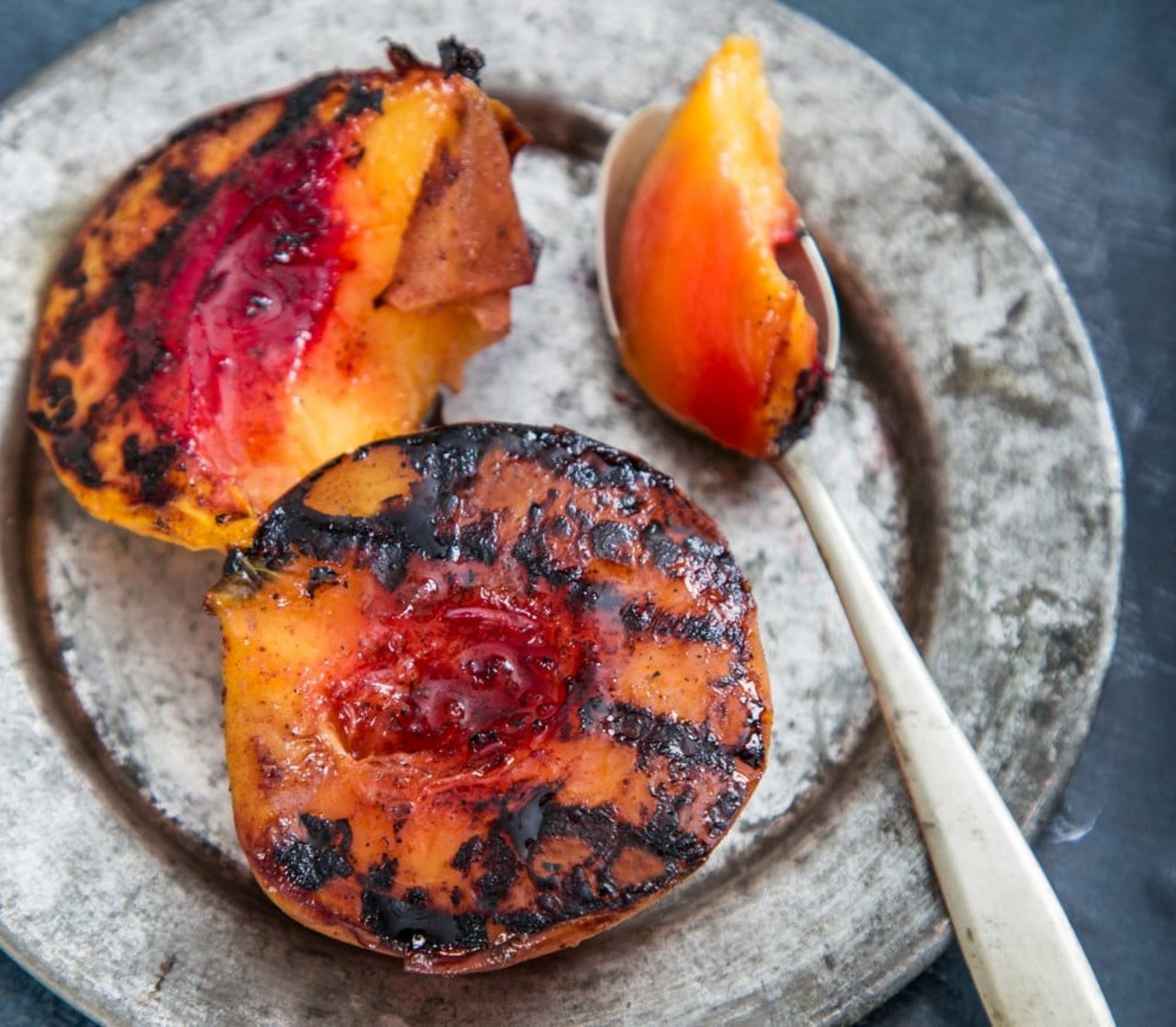 Grilled peaches on a plate