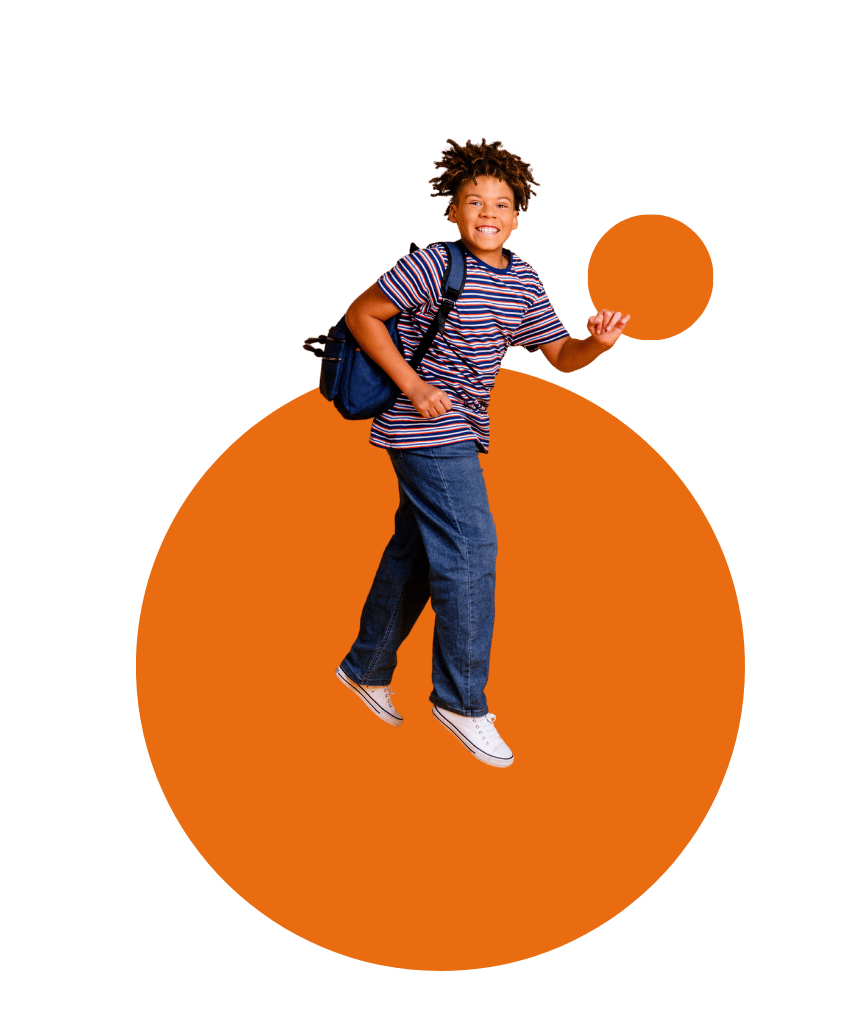 A school-age kid with a blue backpack jumps with two orange circles in the background.