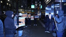 World Animal Protection staff and volunteers protesting outside of Groupon’s company holiday party at its Chicago headquarters.