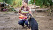 Woman with dog in Costa Rica after Hurricane Otto - World Animal Protection
