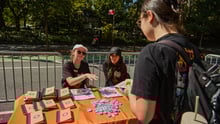 World Animal Protection staff talking to a supporter at an event.