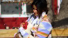 World Animal Protection Global Ambassador Richa Moorjani at Luvin Arms Sanctuary, holding Diego the rooster.