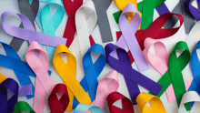 A collection of different colored disability ribbons.