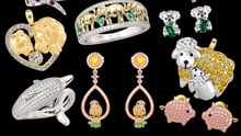 A collection of Jeulia animal-themed jewelry overlayed on a black background.