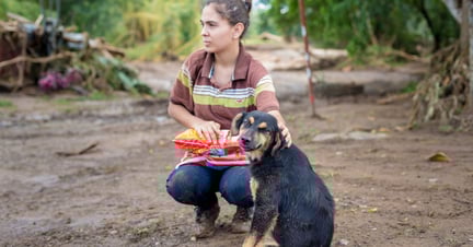 Woman with dog in Costa Rica after Hurricane Otto - World Animal Protection