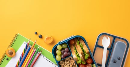A generic school lunch and supply background.
