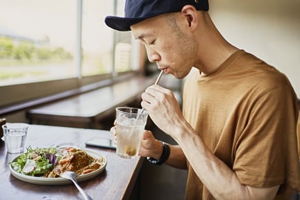 man eating plant based at a restaurant