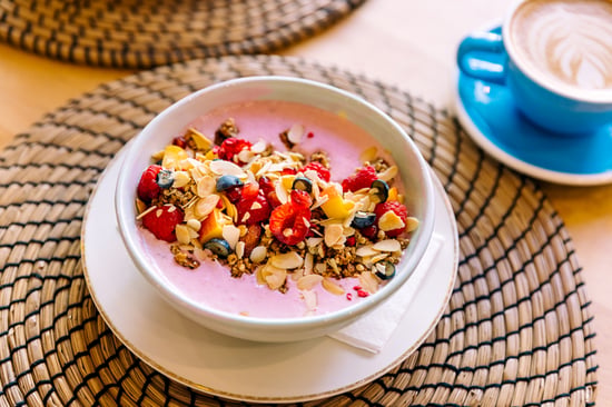 A bowl with yogurt, fruit, and granola.