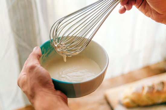 Whisking batter in a bowl.