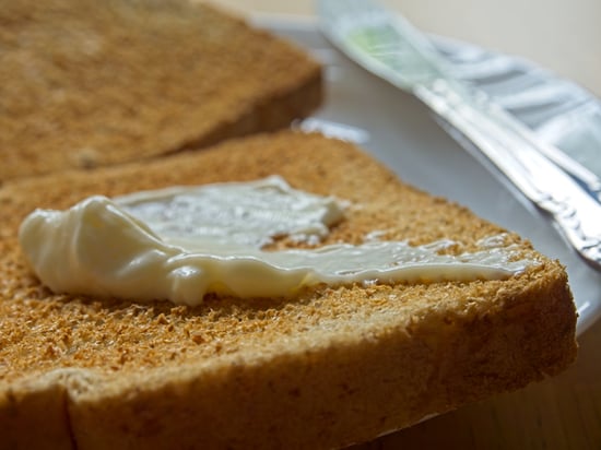 Mayo spread on a piece of toasted bread.