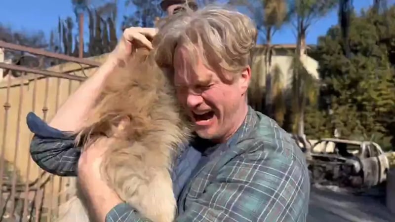 A man reunited with his dogs who were trapped inside his home during the Los Angeles wildfires.