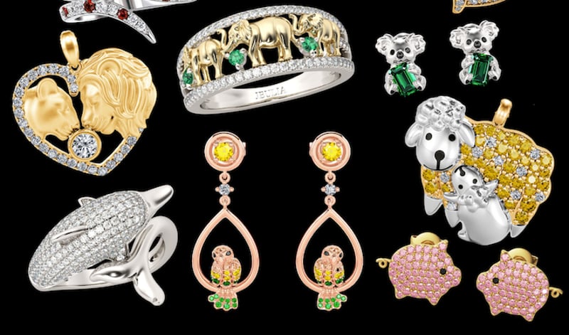 A collection of Jeulia animal-themed jewelry overlayed on a black background.