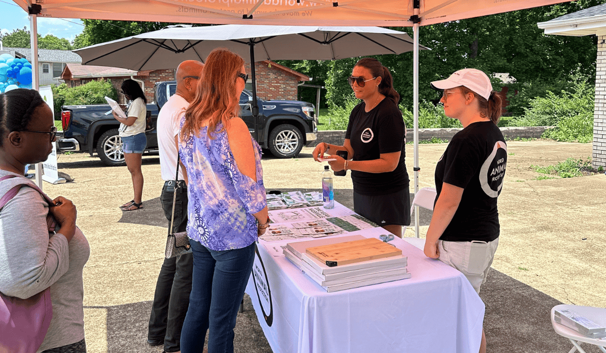 Two of our team members talking to supporters at Dine Vegan Nashville 2025.