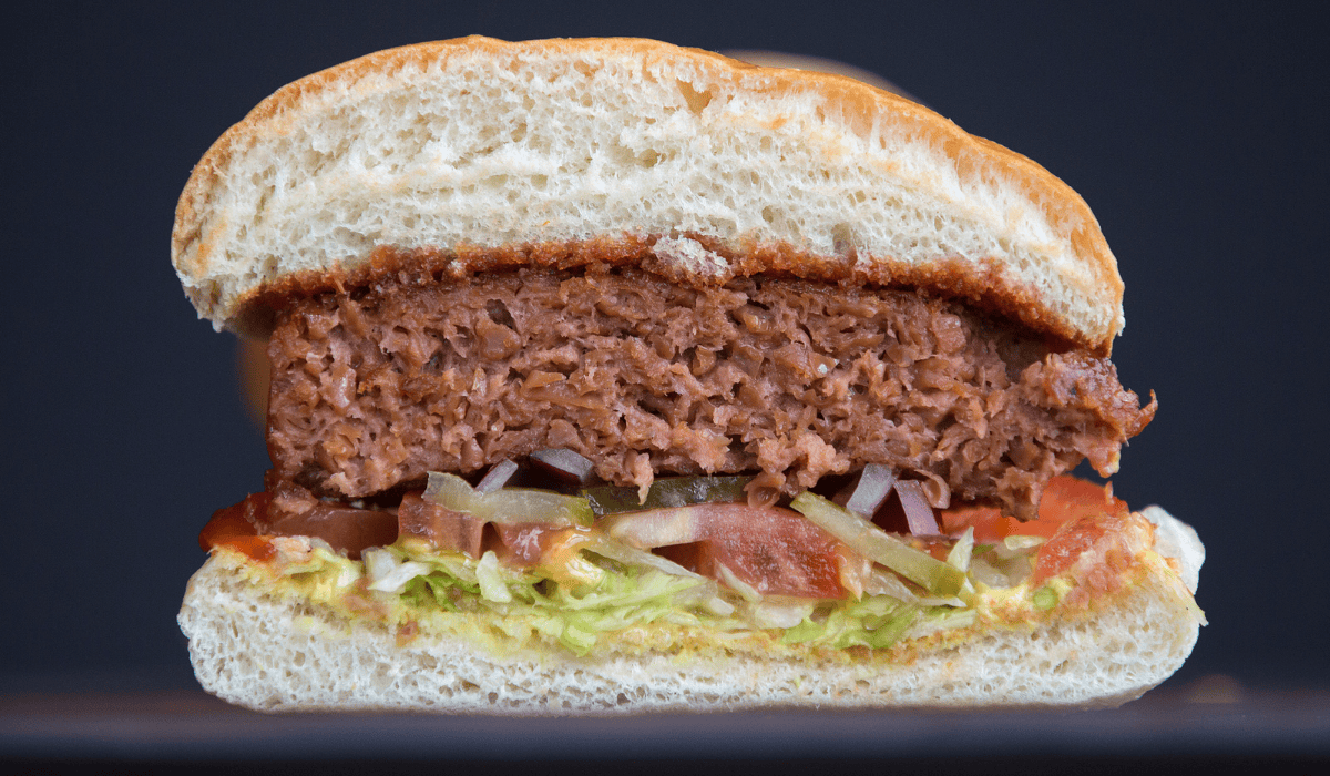 A vegan burger cut in half down the middle.