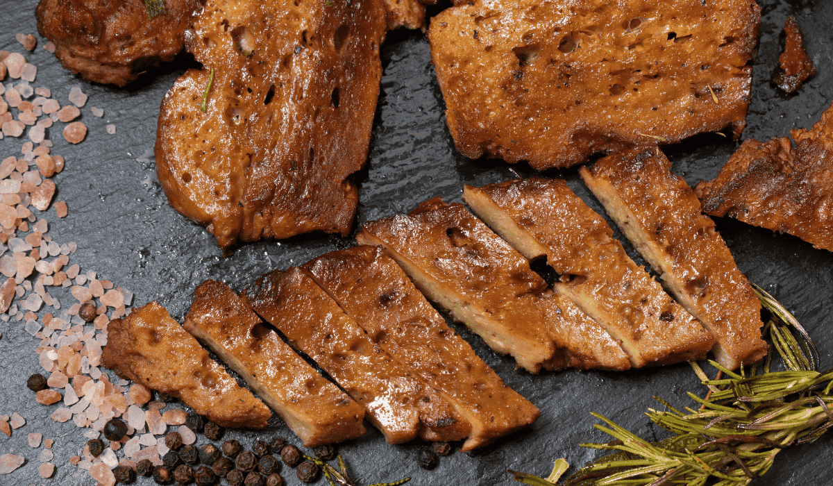 A plate of grilled seitan steak.