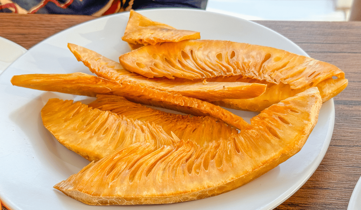Fried breadfruit on a plate.