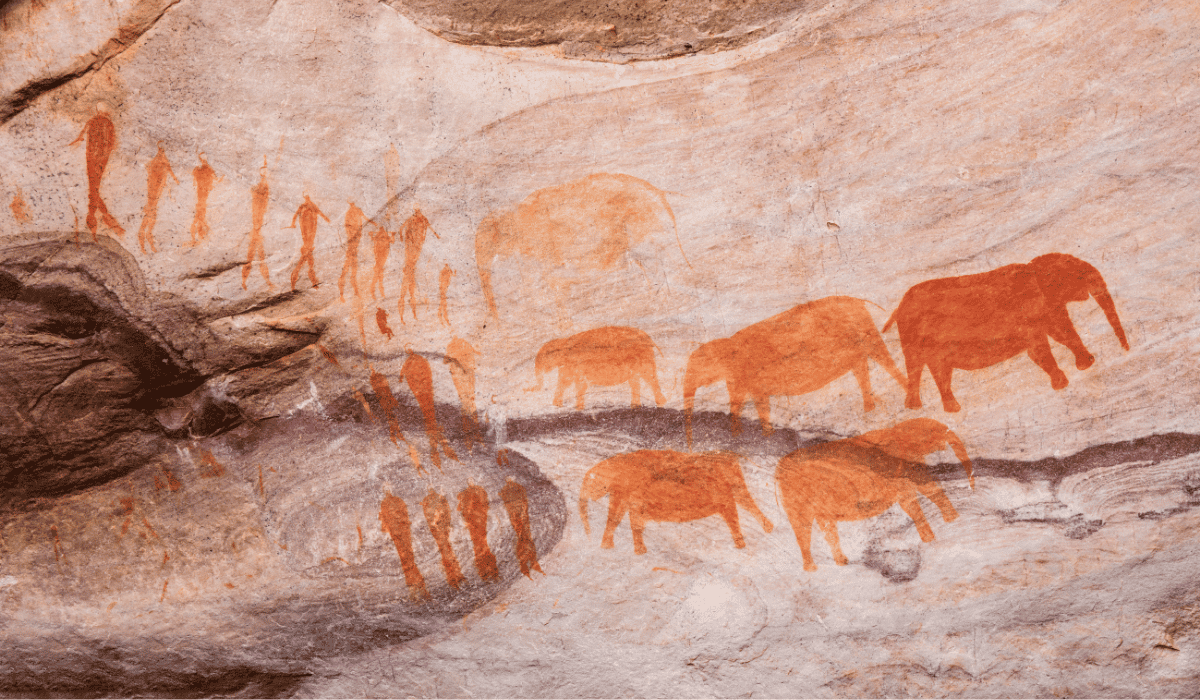 A cave painting of humans and animals.