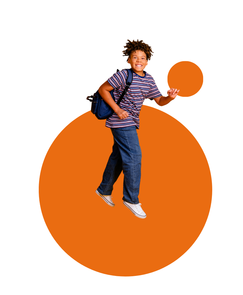 A school-age kid with a blue backpack jumps with two orange circles in the background.